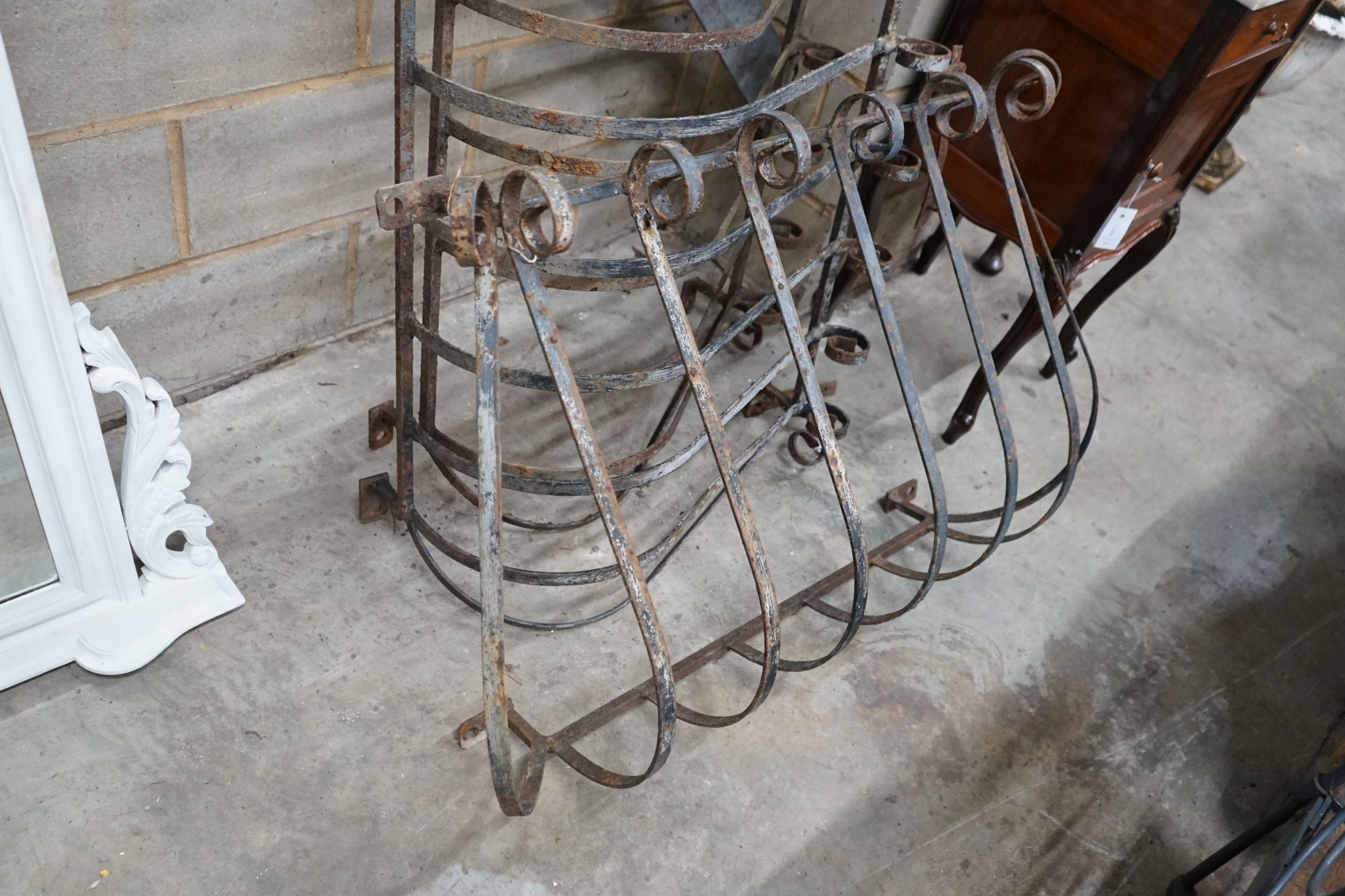 Three vintage wrought iron scrolling balcony railings, largest width 145cm, height 70cm